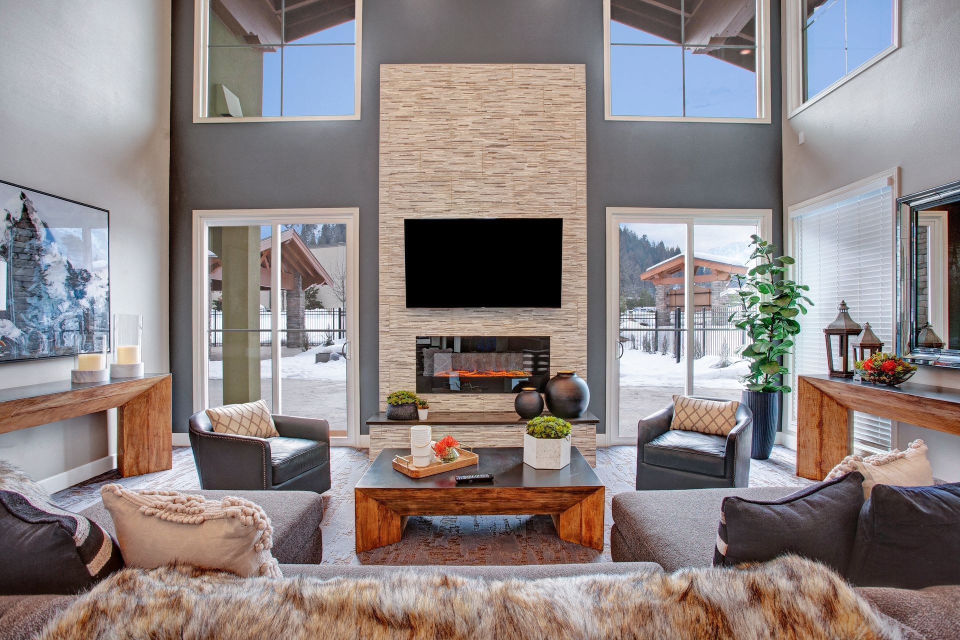 A living room with a fireplace and a flat screen tv.