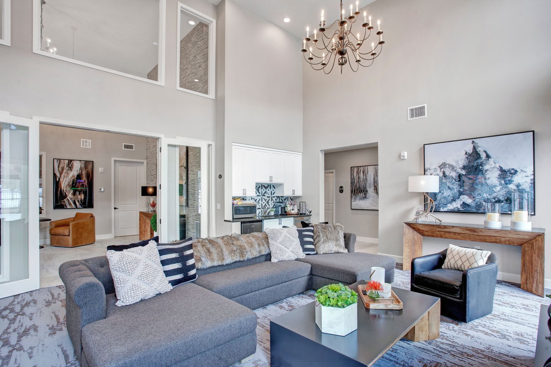 A living room filled with furniture and a chandelier.