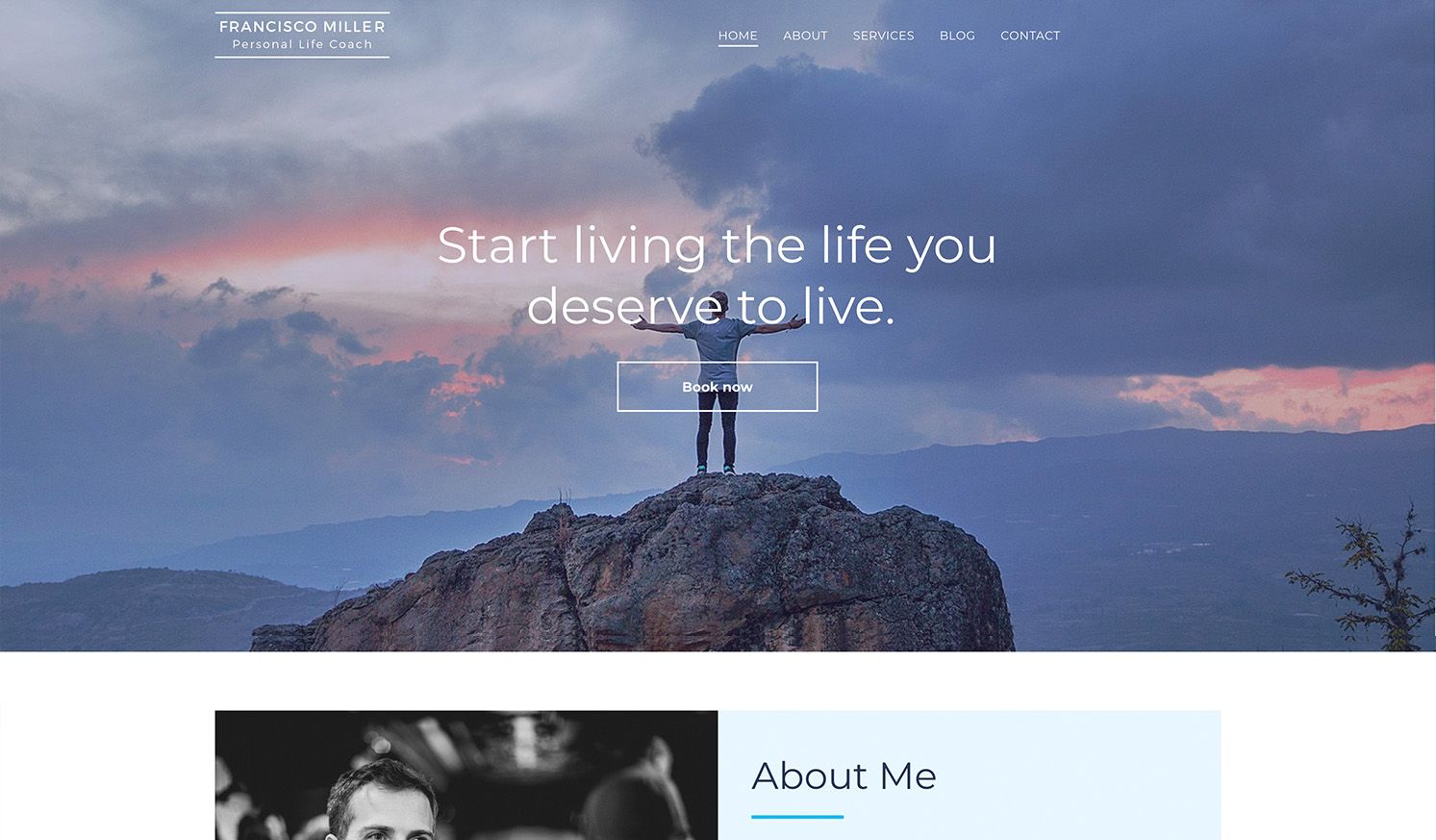 A man is standing on top of a mountain.