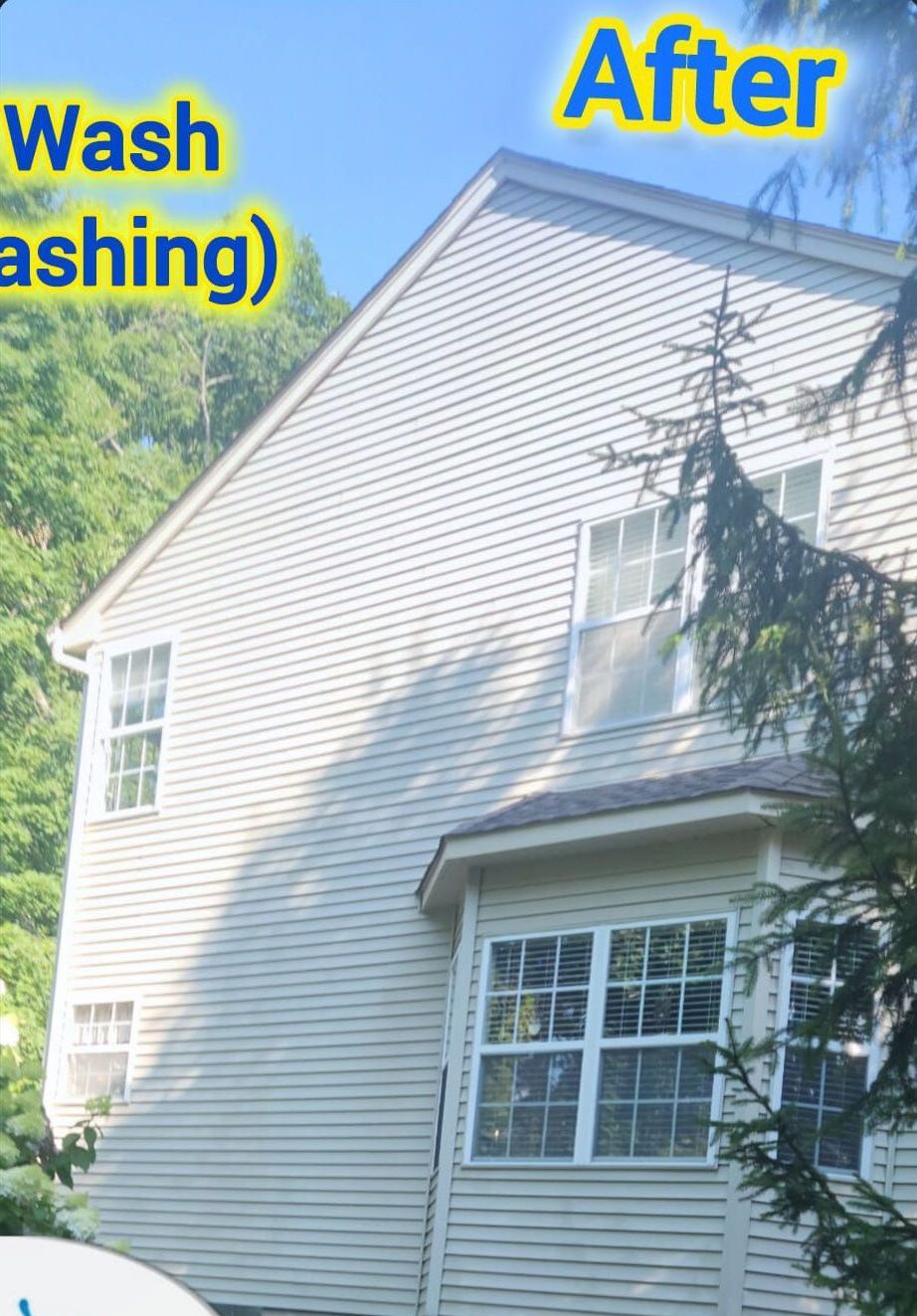 Power washing a house