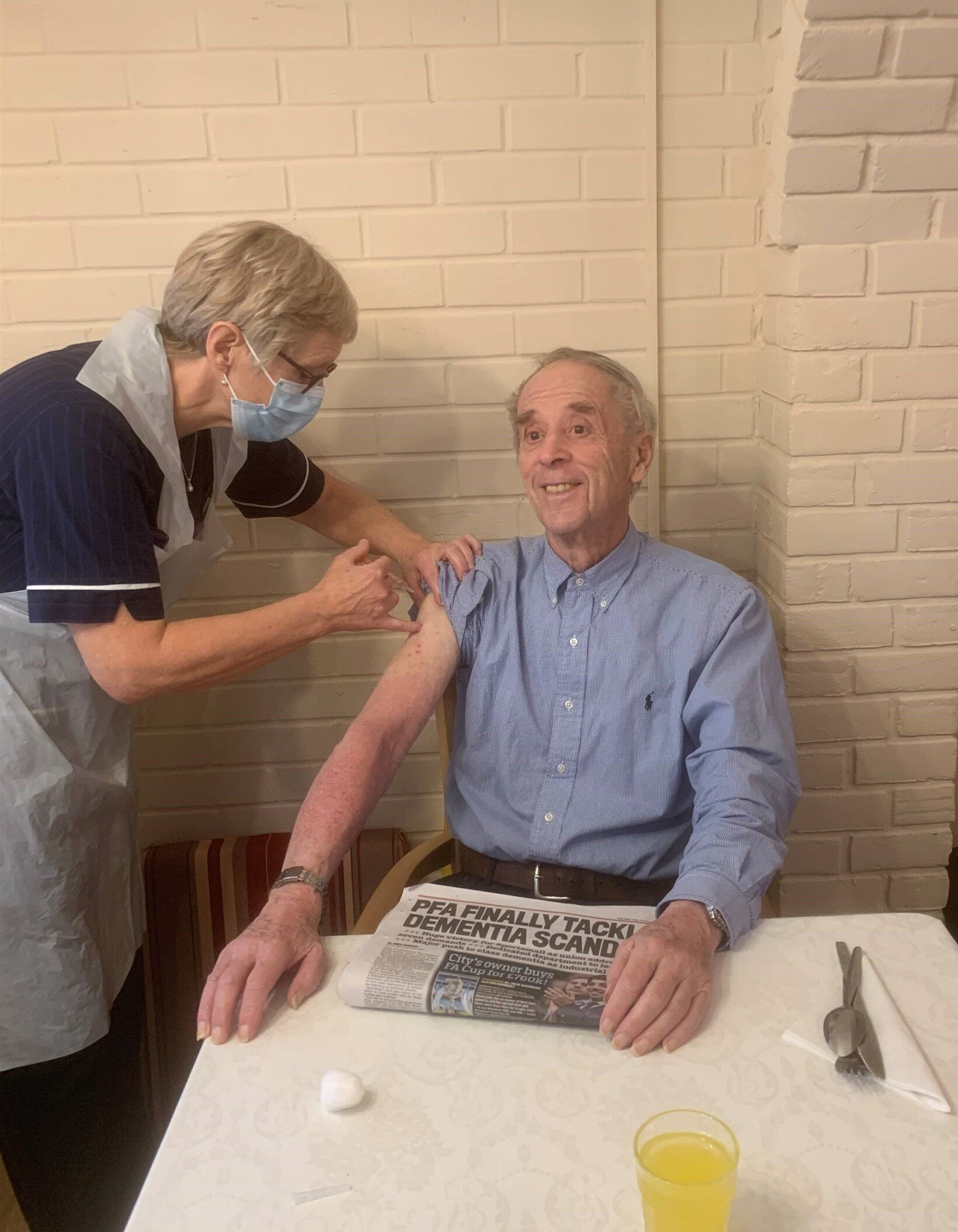 Wyndham House Residents receiving the vaccine from a nurse