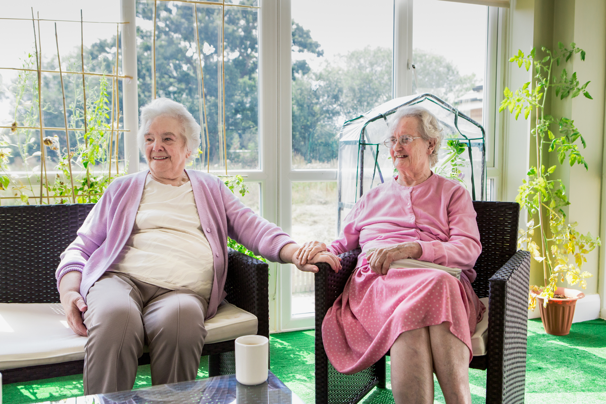 Compassionate Nurse Offering Respite Care to a Senior Woman