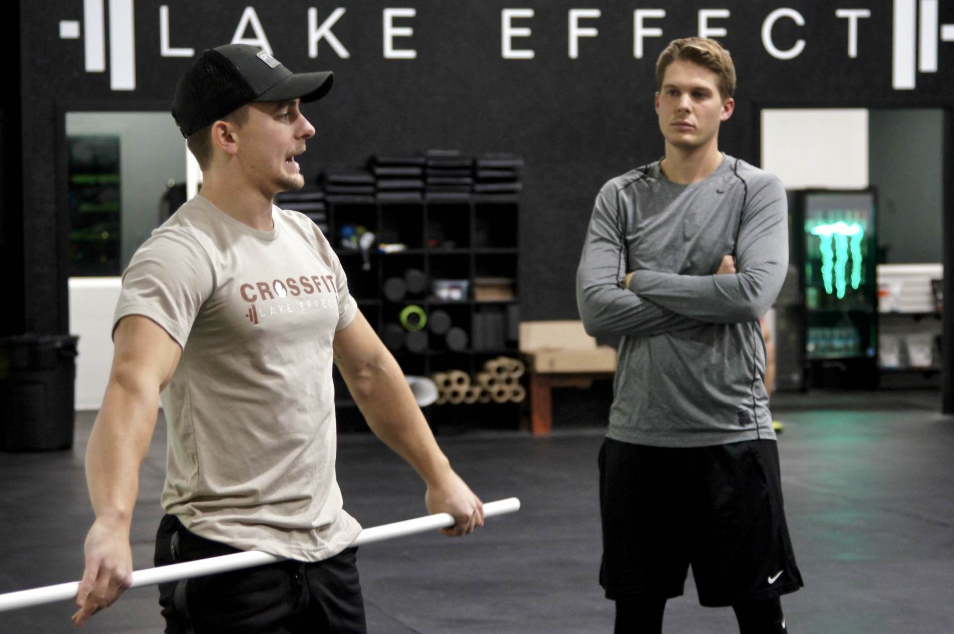 Two men are standing in front of a sign that says lake effect