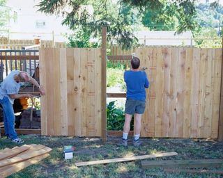 Carpenters Building a Fence - Fence Contractors & Builders