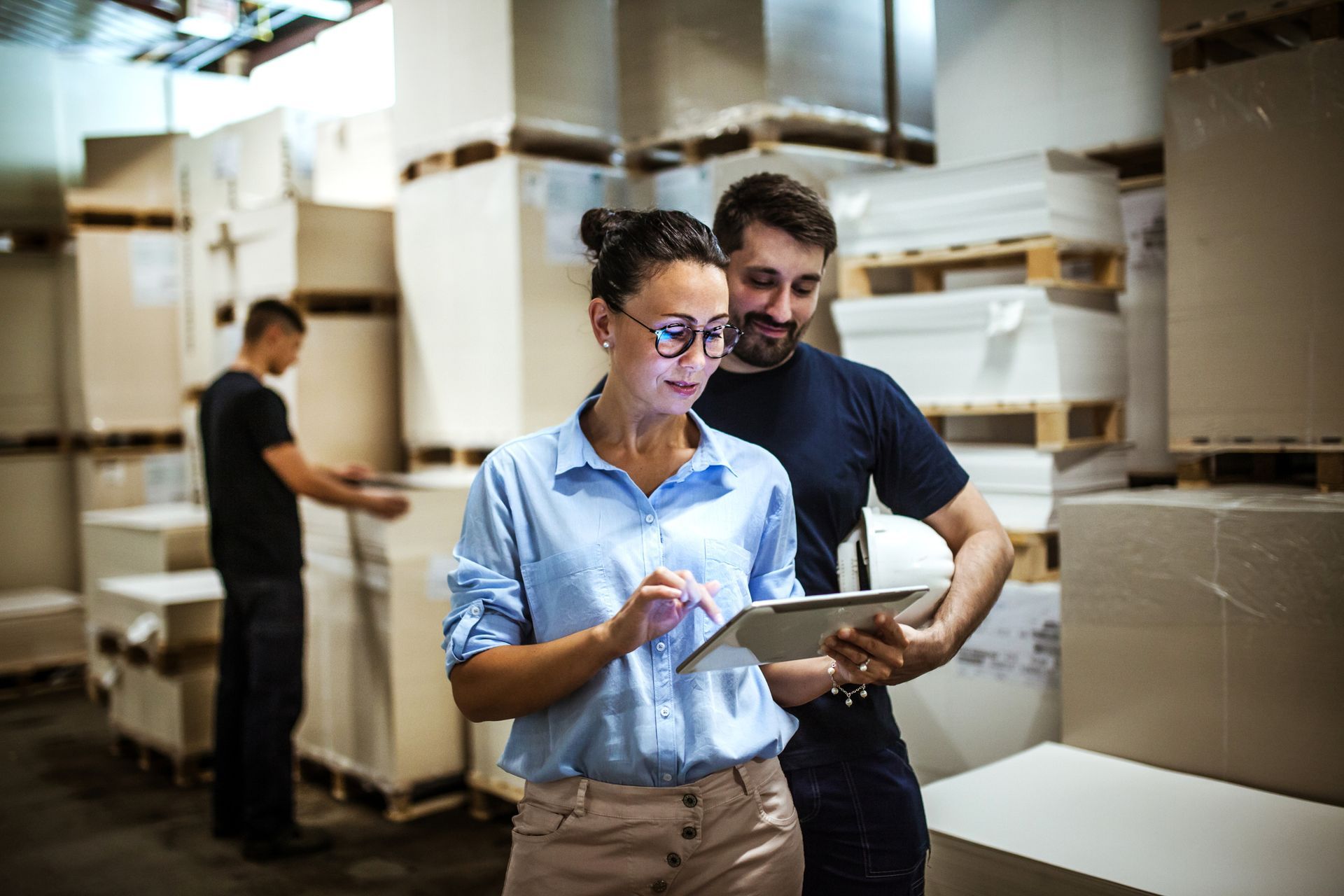 employees at a warehouse using their in house network to do inventory