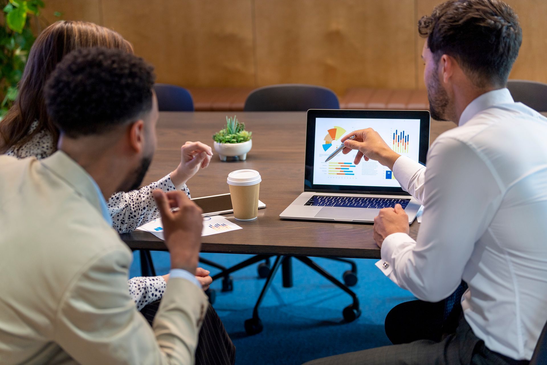 finance workers using a computer maintained by managed IT services