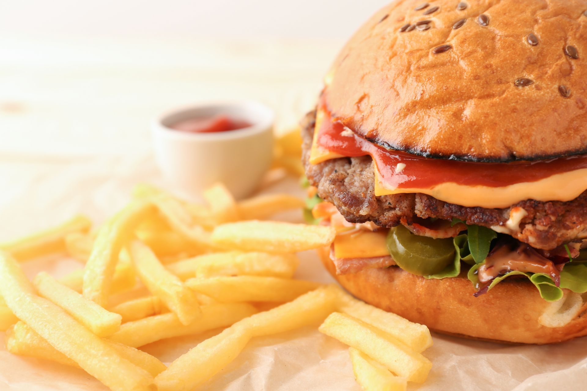 Burger with fries and ketchup on a plate