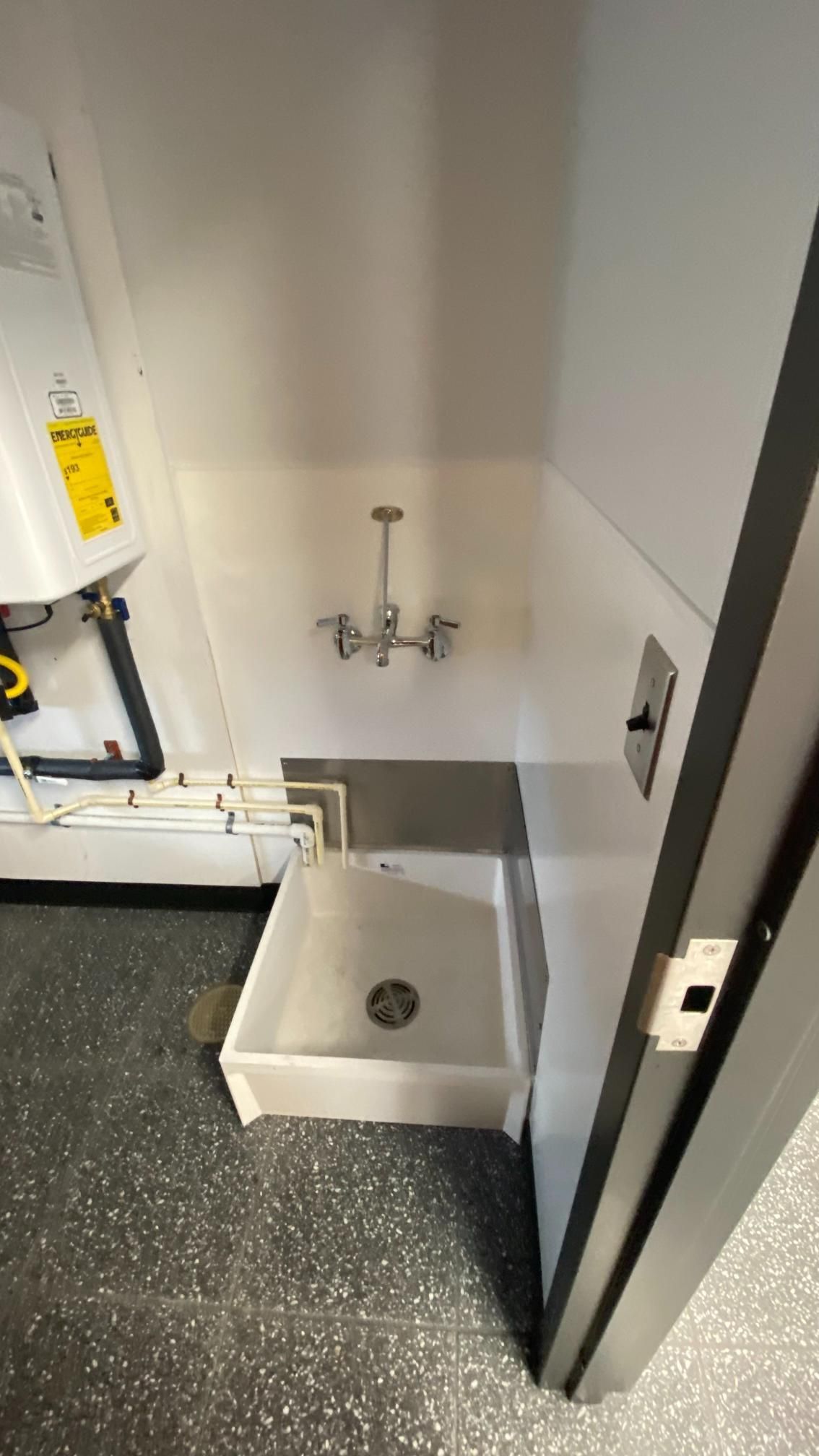 A bathroom with a sink and a shower.