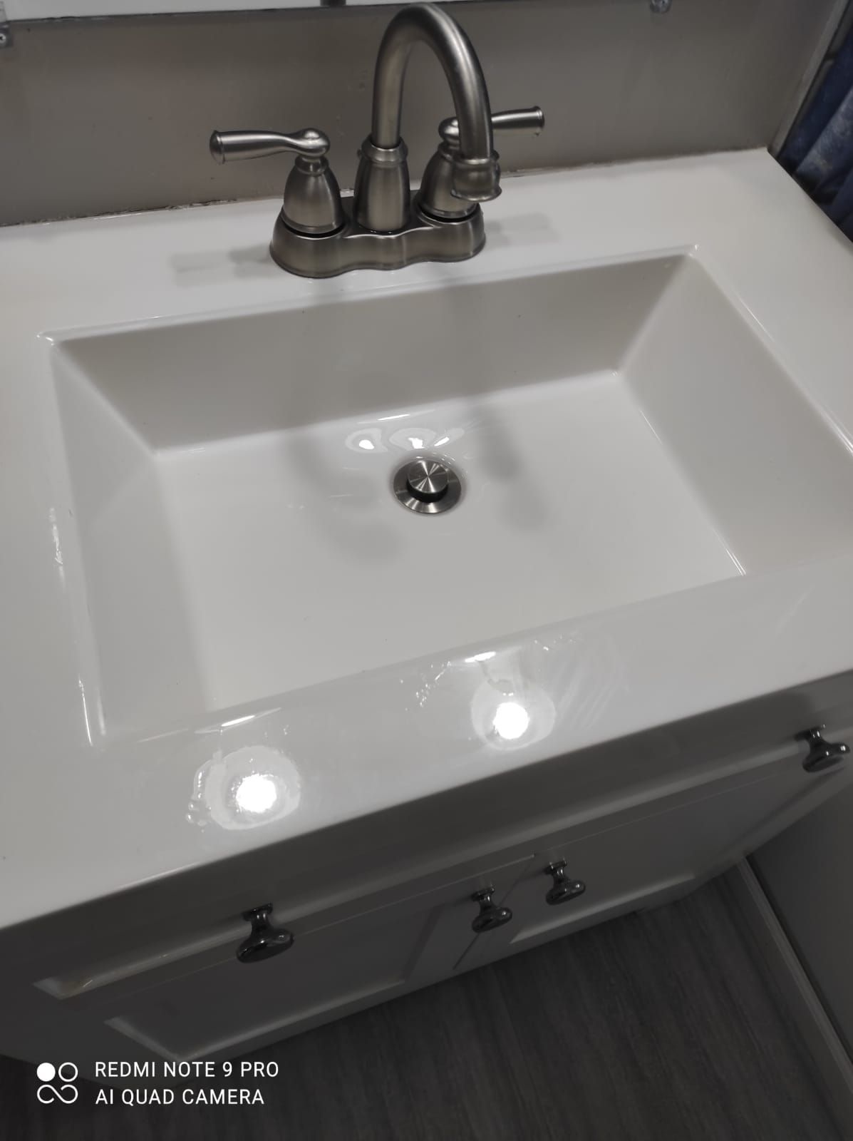 A bathroom sink with a faucet on top of it