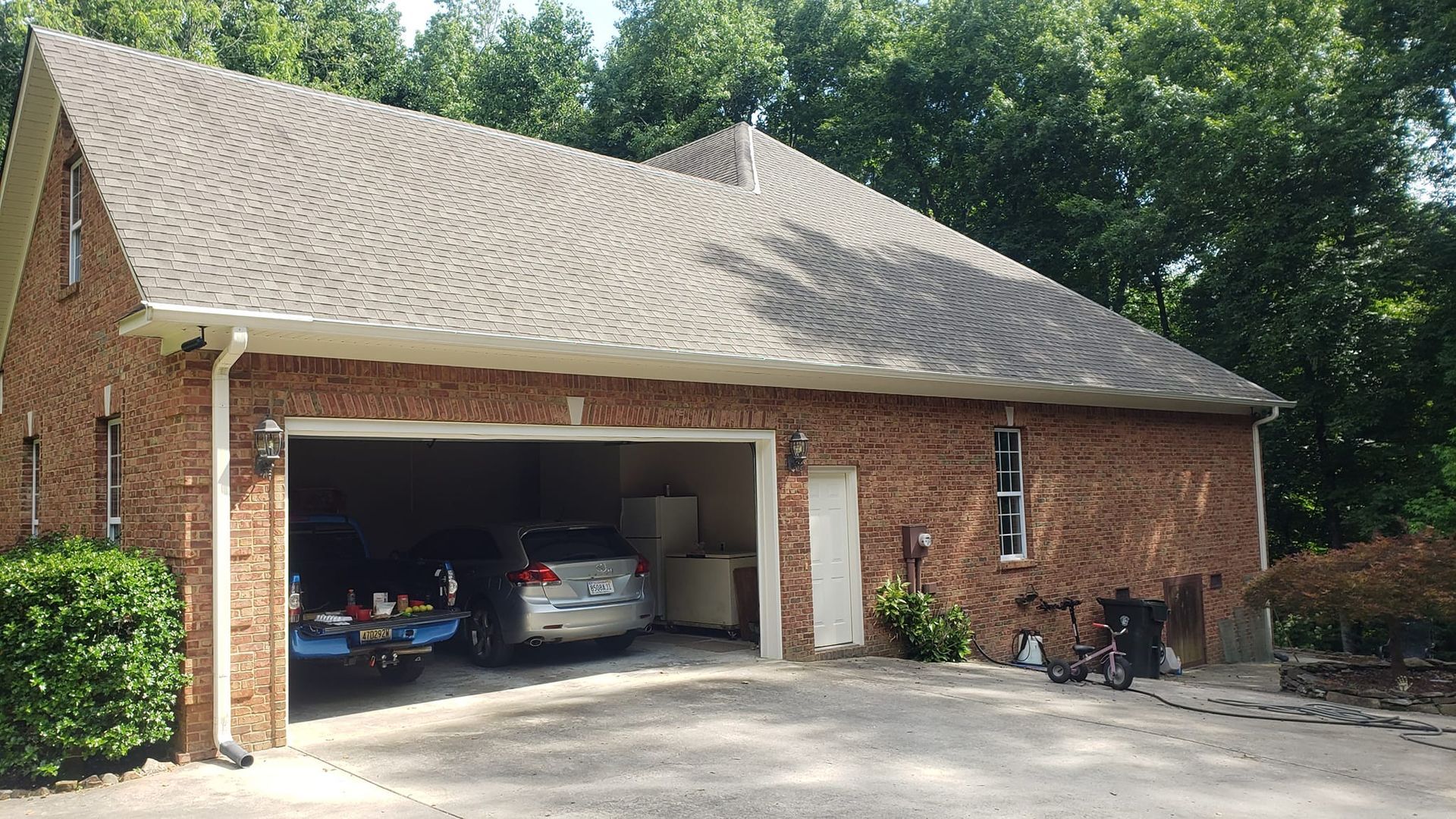 After Soft Wash Brick House With Cars in Garage | Harvest, AL | Radiant Exterior Cleaning