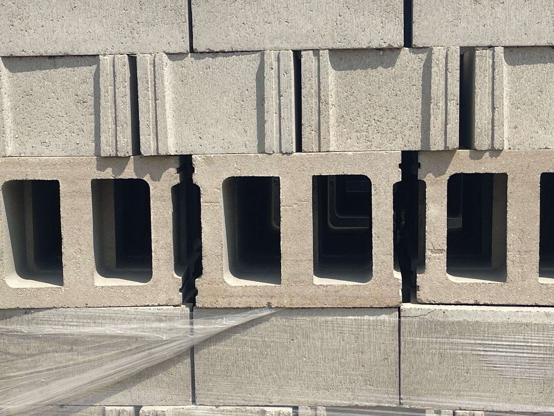 Gray concrete blocks stacked in rows.