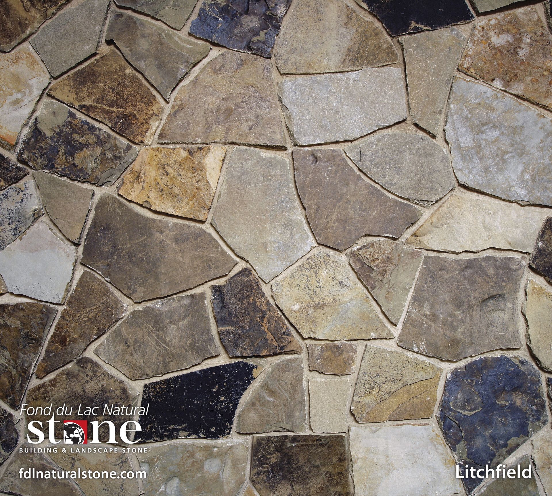 Close-up of Litchfield natural stone wall, featuring various earth-toned, irregularly shaped stones.