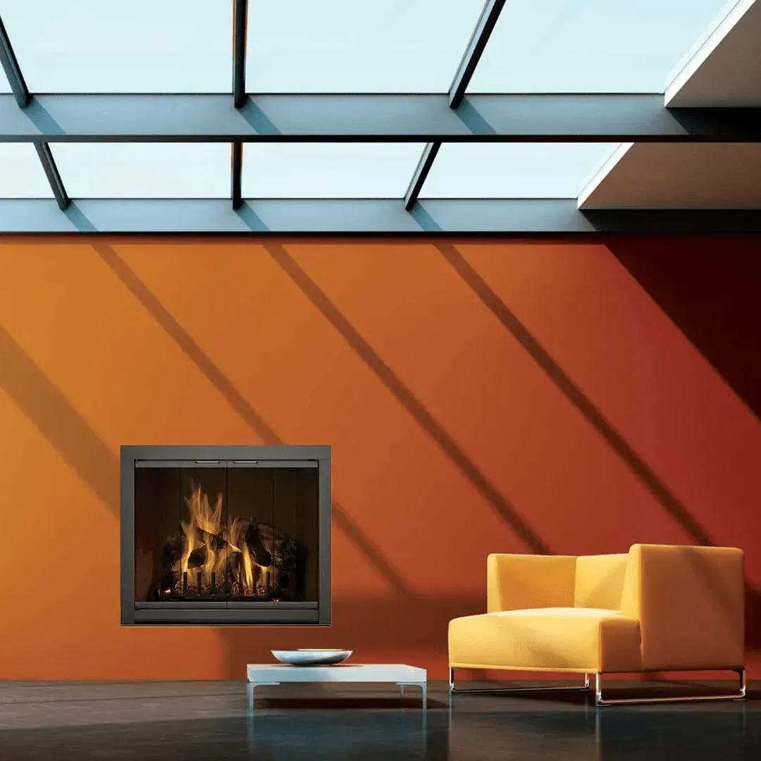 Orange wall with fireplace, yellow armchair, and skylight shadows.