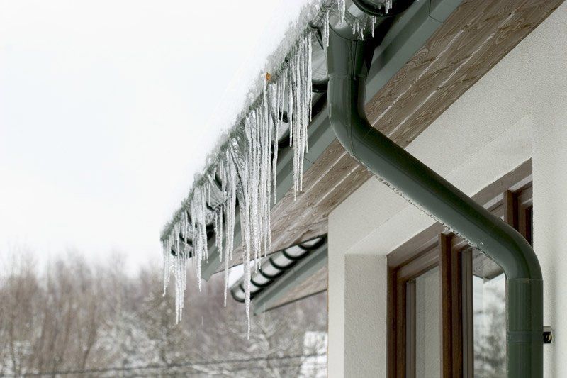 Licensed Roofer — Icicles Hanging from the Roof of a House in West Boylston, MA