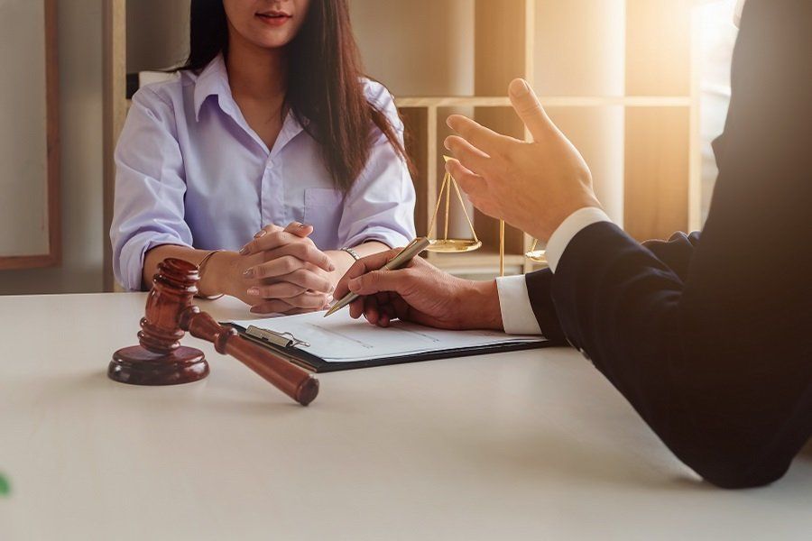 a professional lawyer speaking to a female client