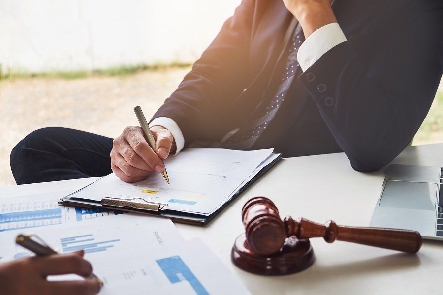 a professional attorney making notes in a diary
