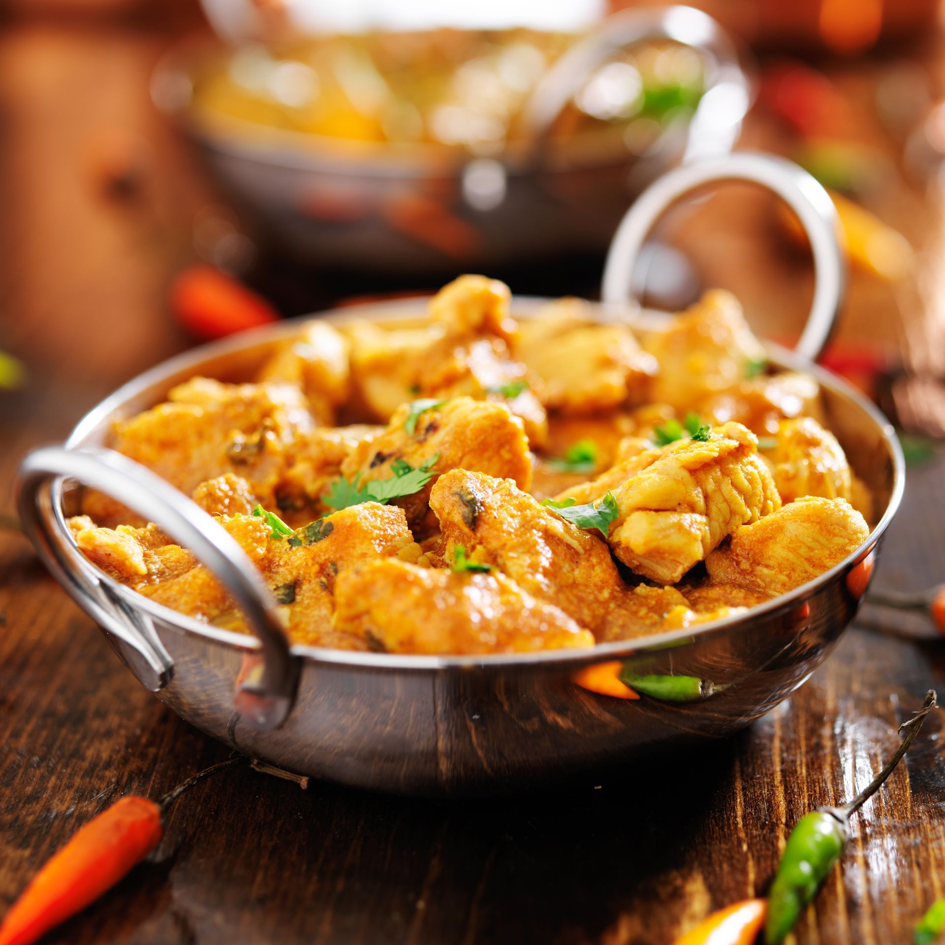Indian chicken curry in a metal dish