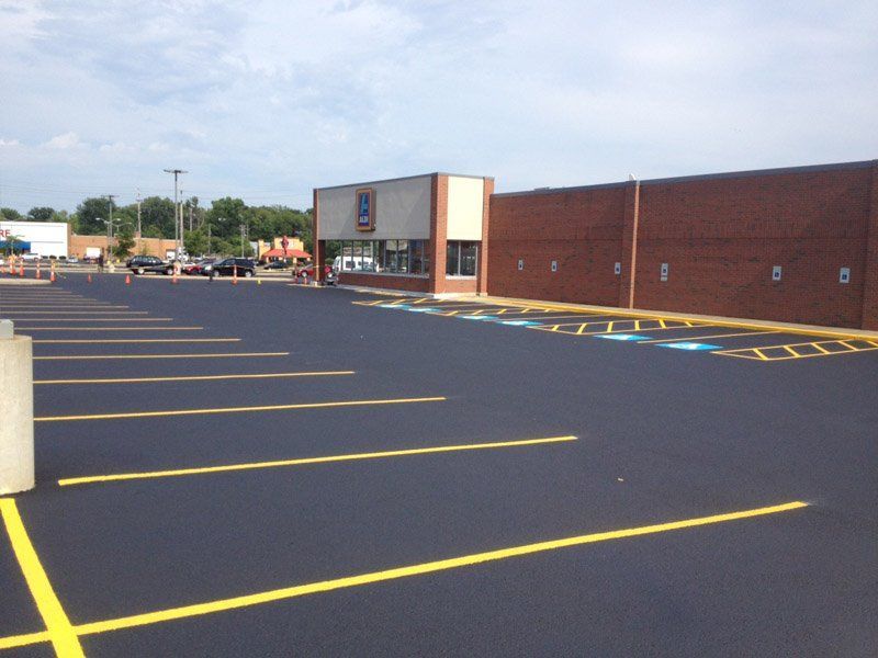 An empty parking lot in front of an aldi store