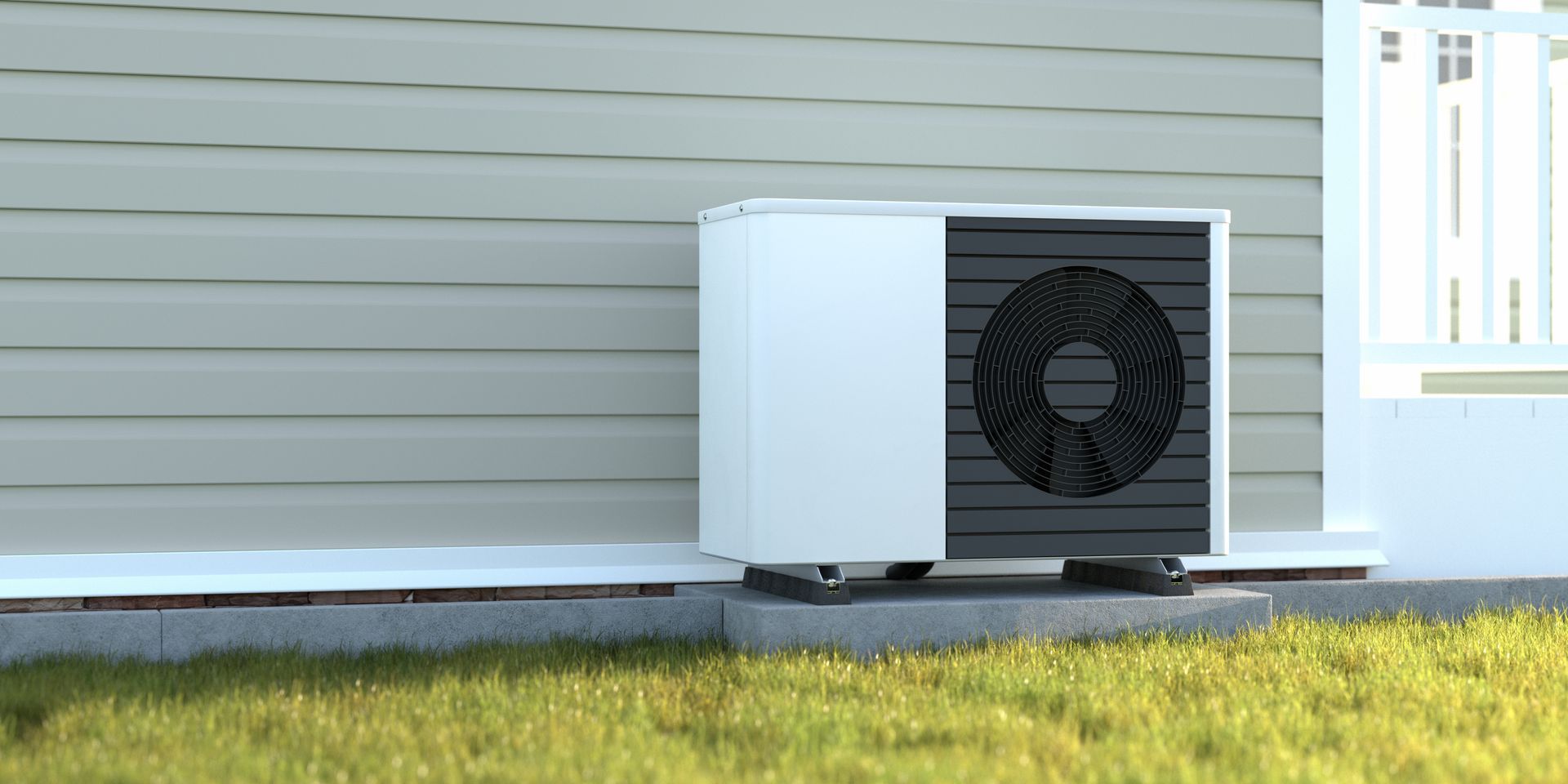 An air conditioning unit next to a house with white siding and a green lawn.