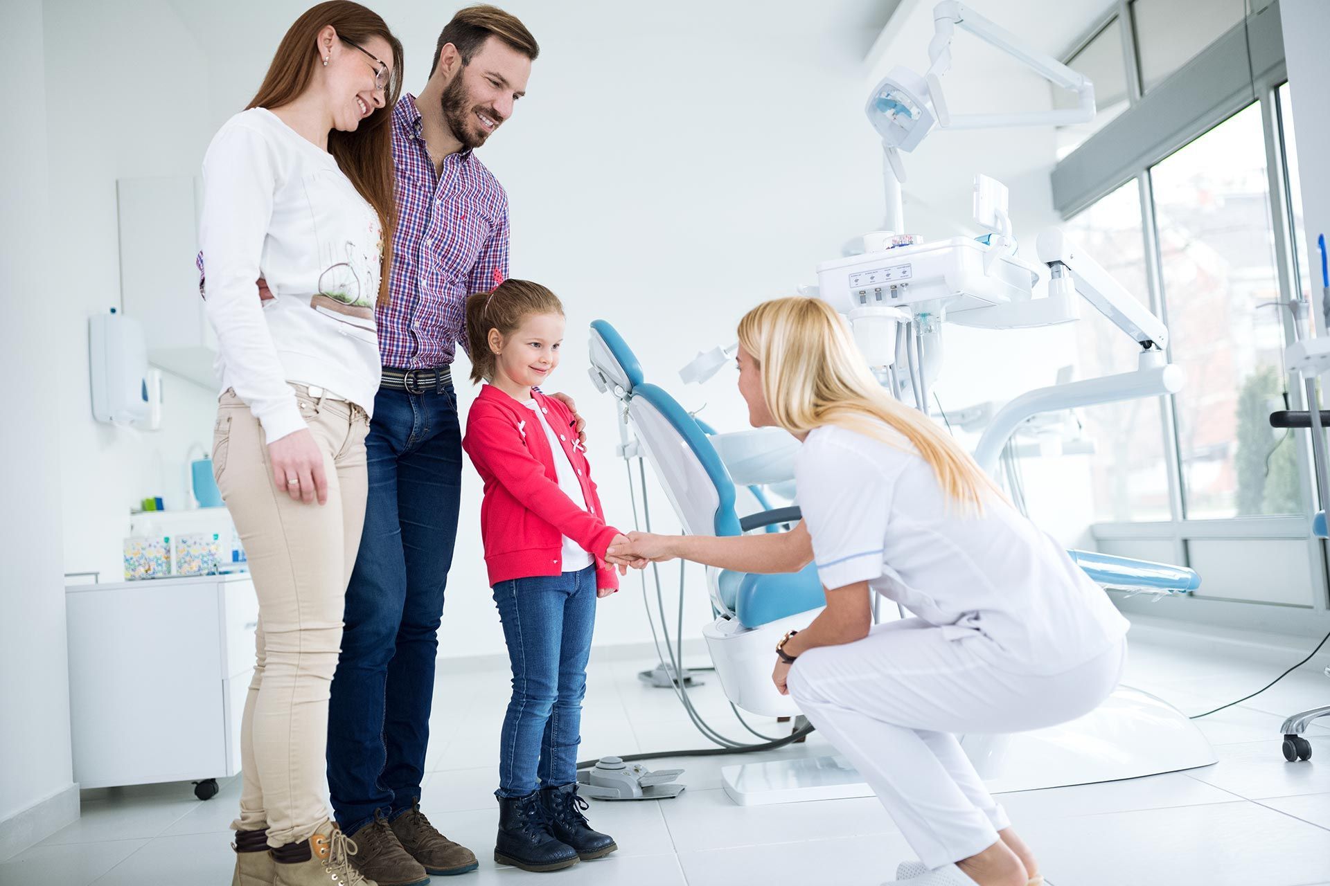 Family visits the dentist in the dental office.