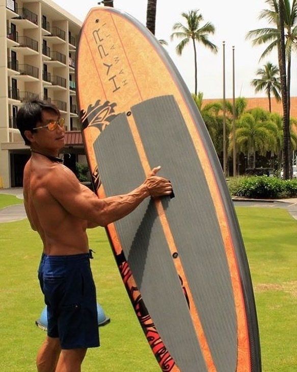 ian foo holding a hypr hawaii paddle board