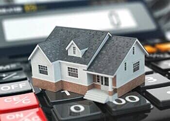 Miniature House Over a Calculator — Santa Cruz, CA — Dan Casagrande - Reverse Mortgages