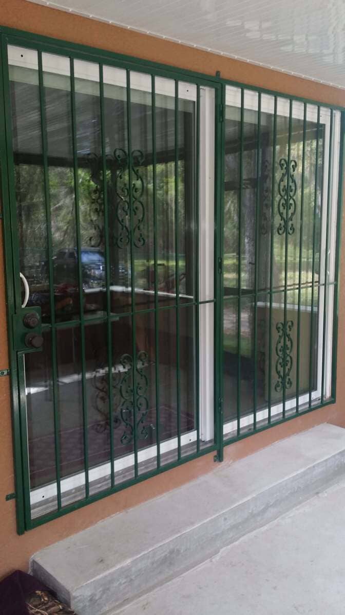 Green window railing—Railing in Tampa, FL