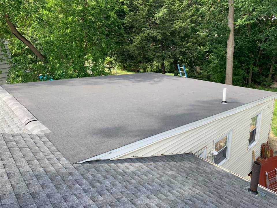 A house with a roof that is covered in shingles.