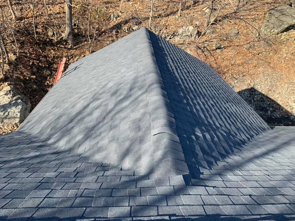 The roof of a house is shaped like a pyramid.