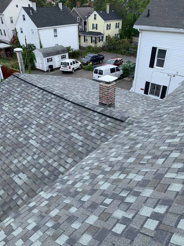An aerial view of a roof of a house with a chimney.