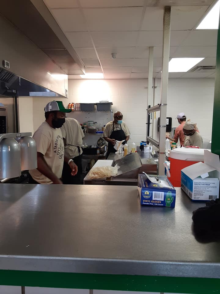 Working in Kitchen — Omaha, NE — A Taste of New Orleans