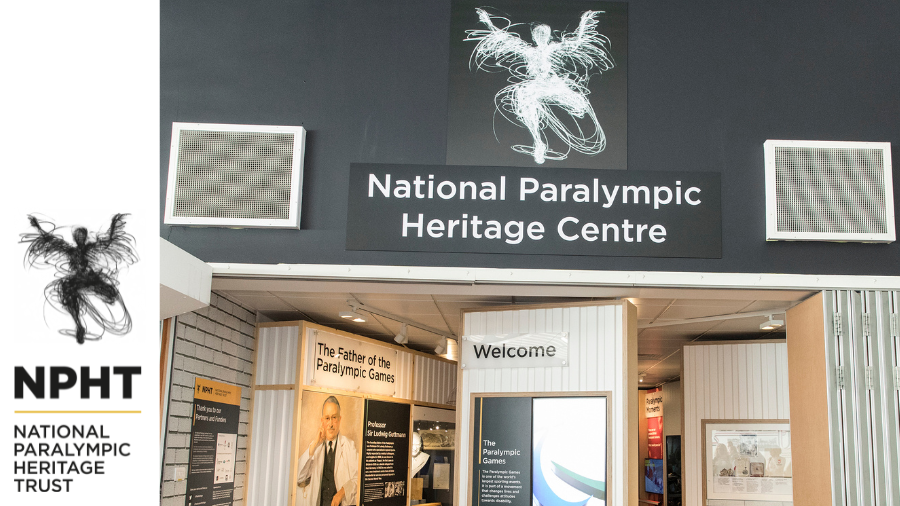 Signage with National Paralympic Heritage Centre undernear is a column with a welcome sign. on the left is the entrance to the museum and a portrait of Sir Ludwig Guttman