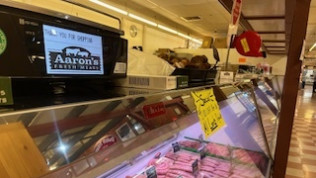 A butcher shop with a sign that says aaron 's