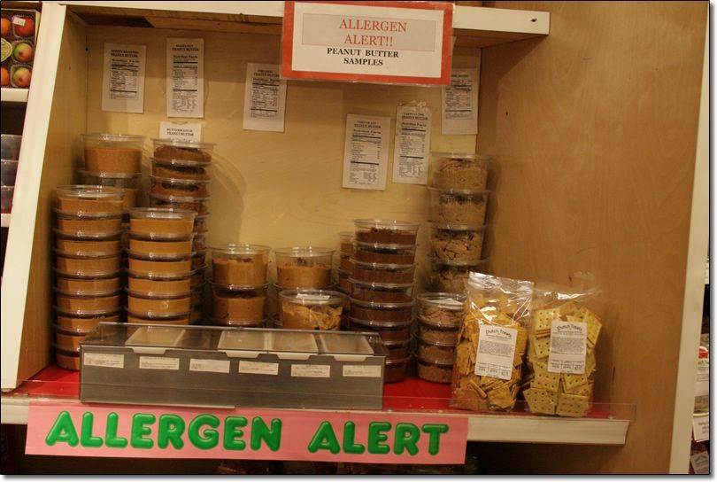 A shelf with a sign that says allergen alert
