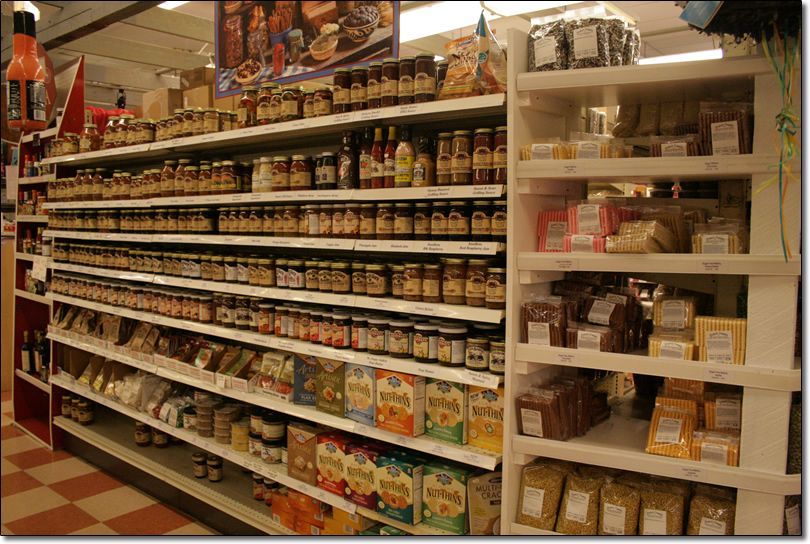 A grocery store aisle filled with jars of food
