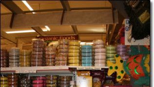 A store with a sign that says ' organic foods ' on it