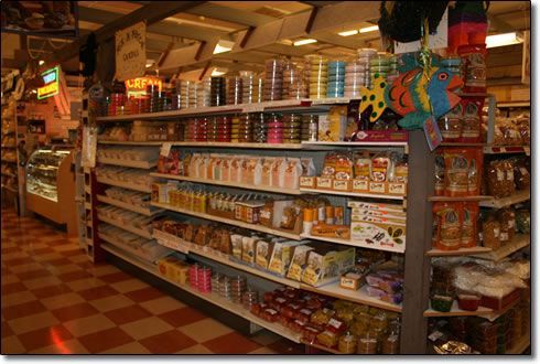 A grocery store aisle filled with lots of food items