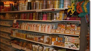 A grocery store aisle with a sign that says cream