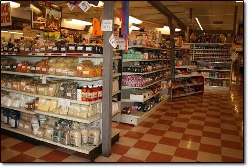 The inside of a grocery store with a checkered floor