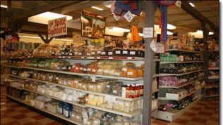 A grocery store aisle with a sign that says long shelf