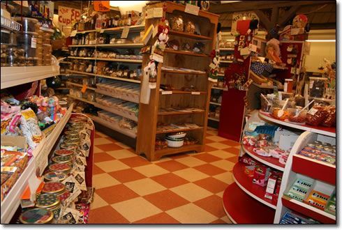 A candy store with a checkered floor and shelves filled with candy