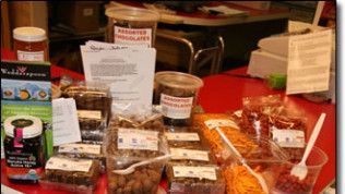 A table with a lot of food on it and a fork on it.