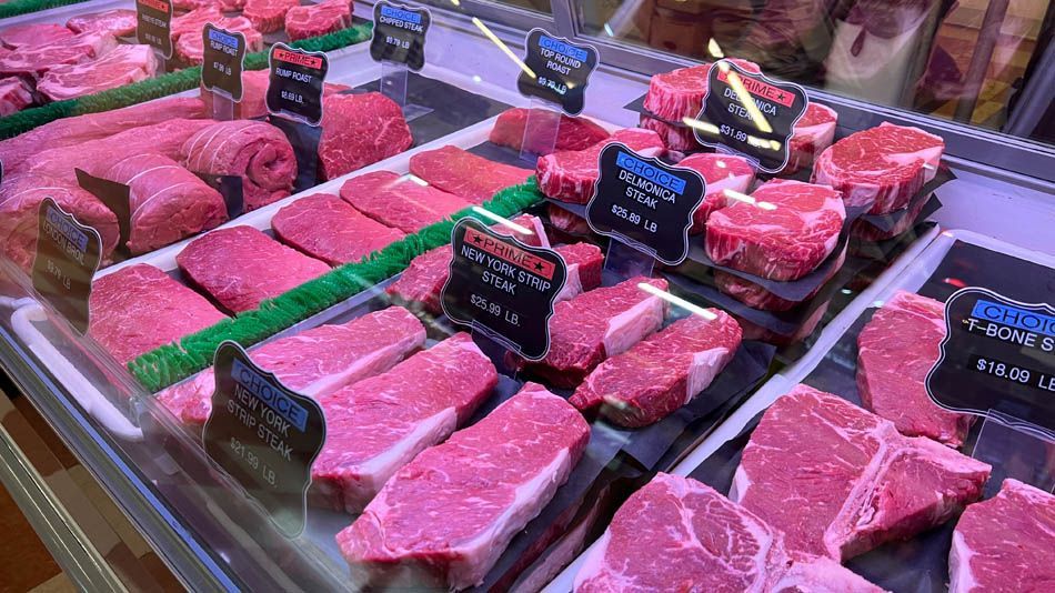 A display case filled with lots of different types of meat.