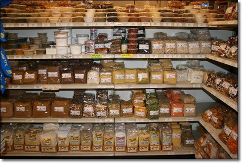 A grocery store shelf filled with lots of food items