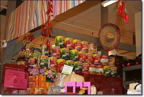 A display of canned vegetables including tomatoes and peppers
