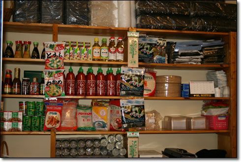 A store shelf filled with lots of food items including pepsi