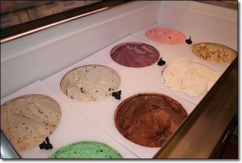 A variety of ice cream flavors in a display case