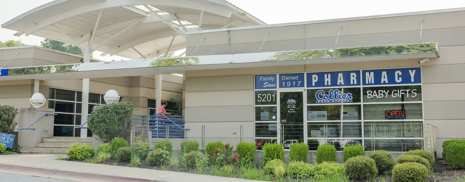 The front of a pharmacy with a sign that says pharmacy