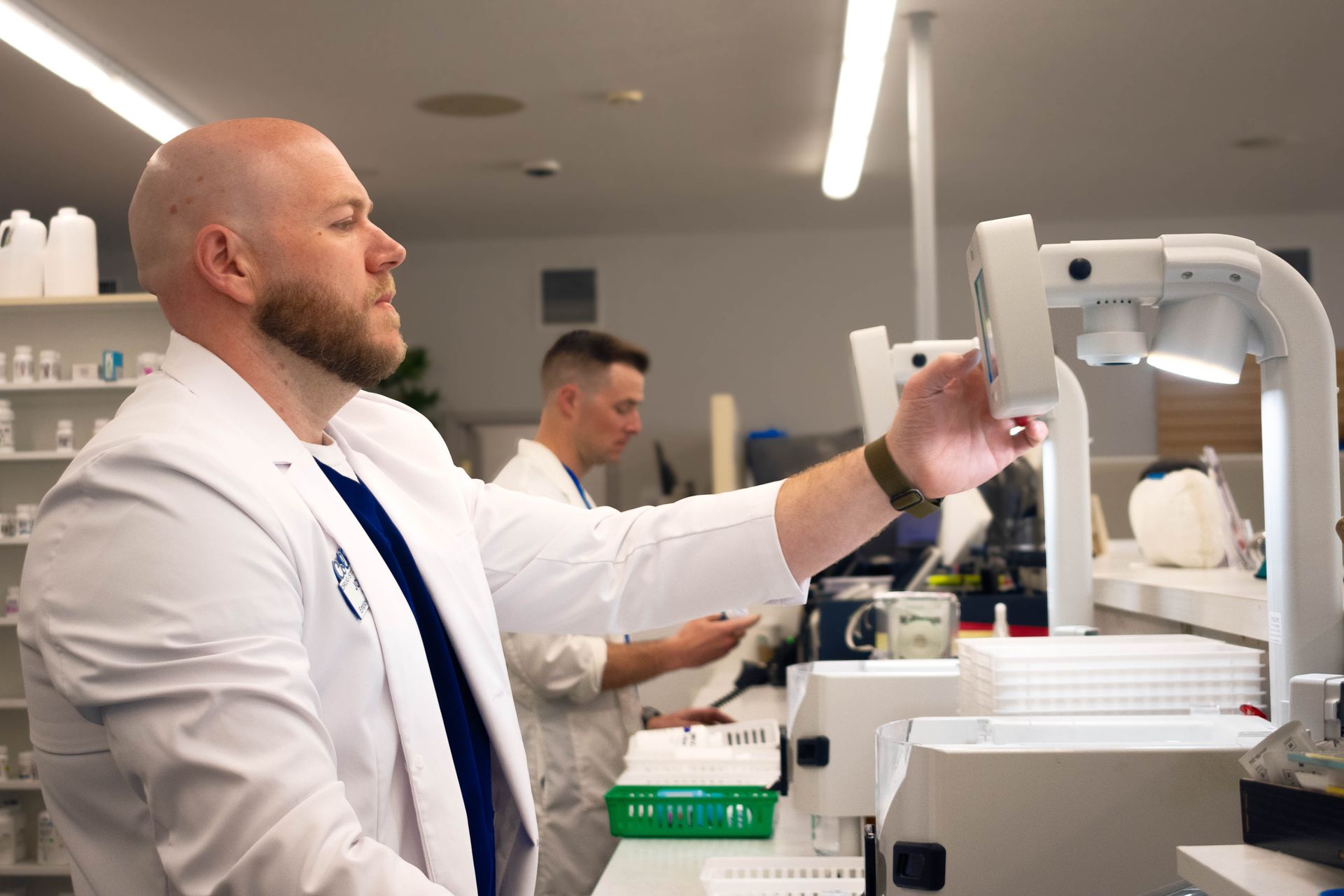 A scientist is using a pipette to pour liquid into a bottle.