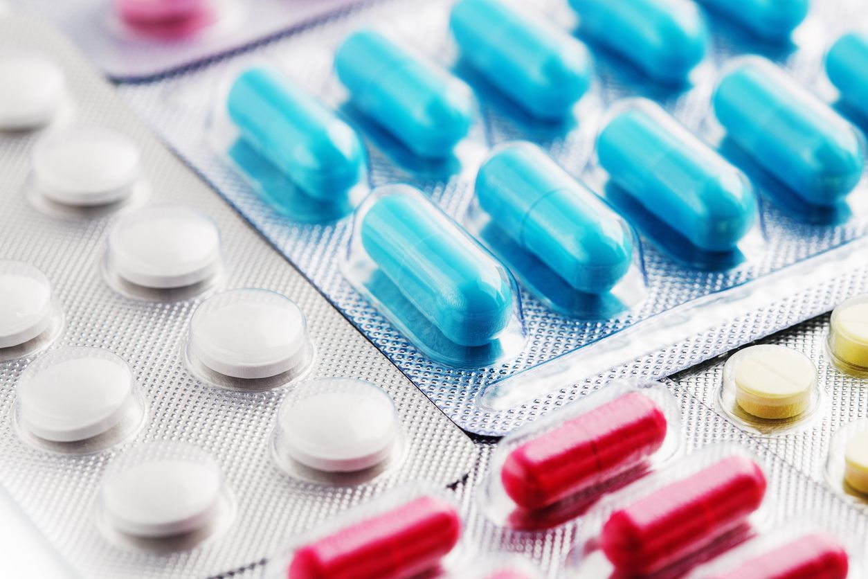 A close up of a blister pack of pills and capsules.